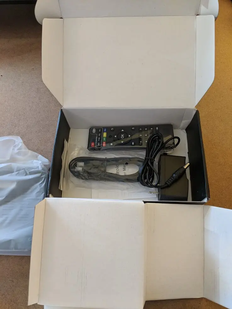 The accessories included in the MX Pro. Power supply, remote, and HDMI cord are all visible. Source: Flixed.io